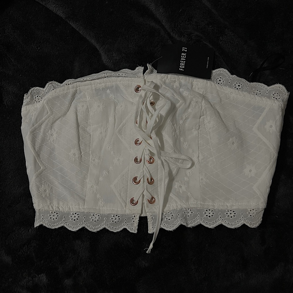 Strapless white crop top.